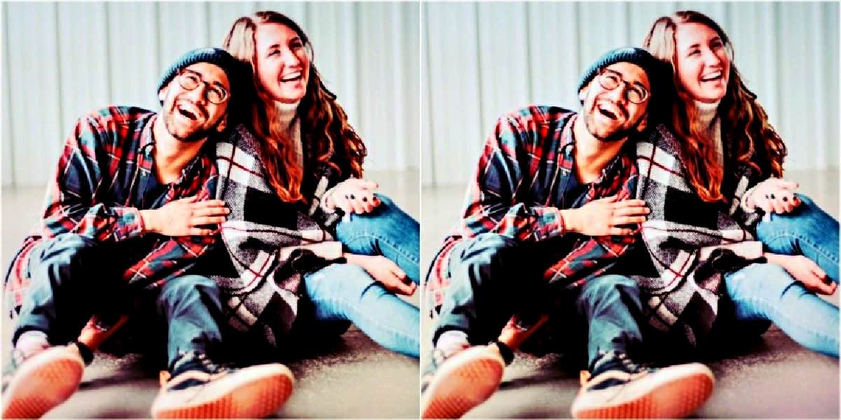 8 Things To Do Together In The New Year happy couple sitting together on the floor laughing