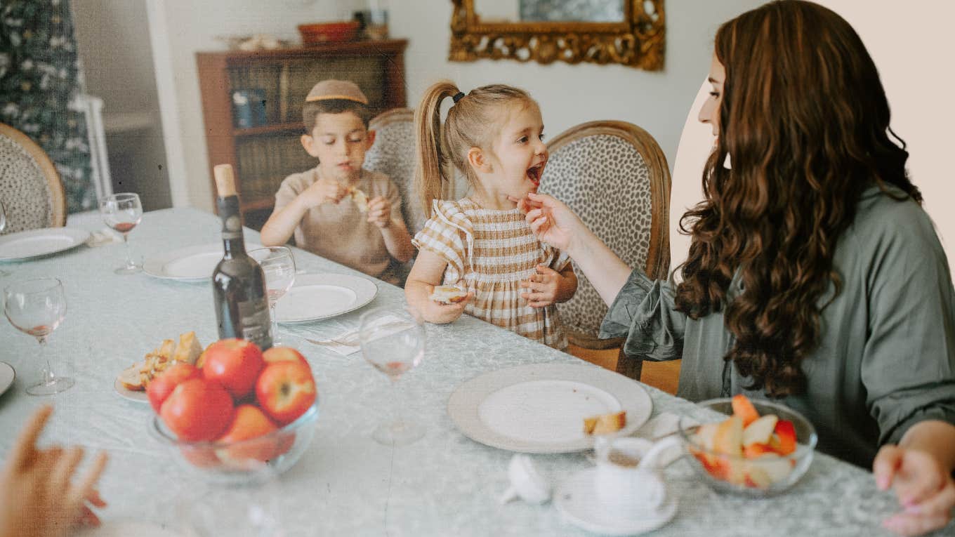 Mother feeding her children lunch while playing and taking all their little cut quirks in