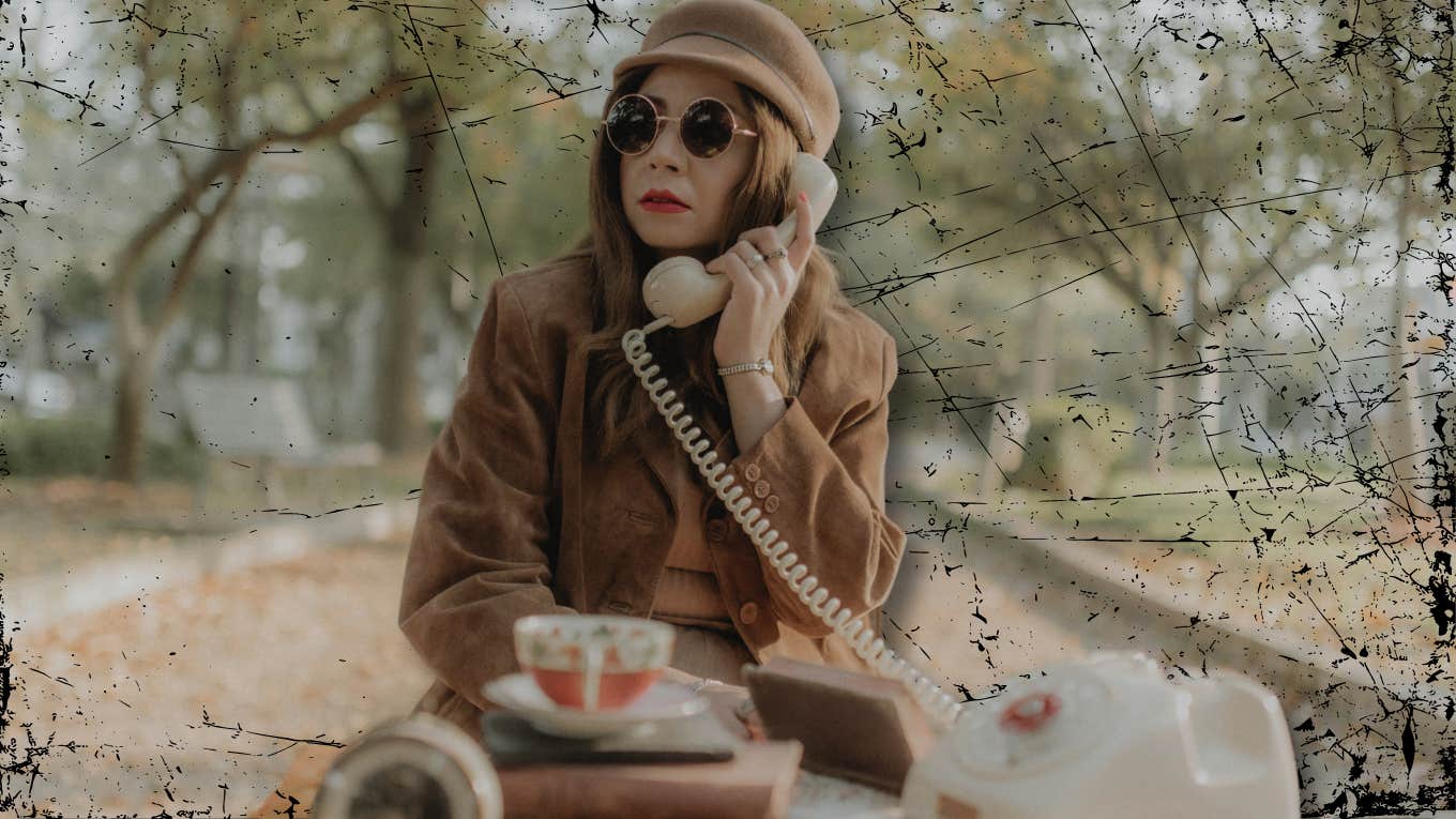 Woman on phone reaching out 