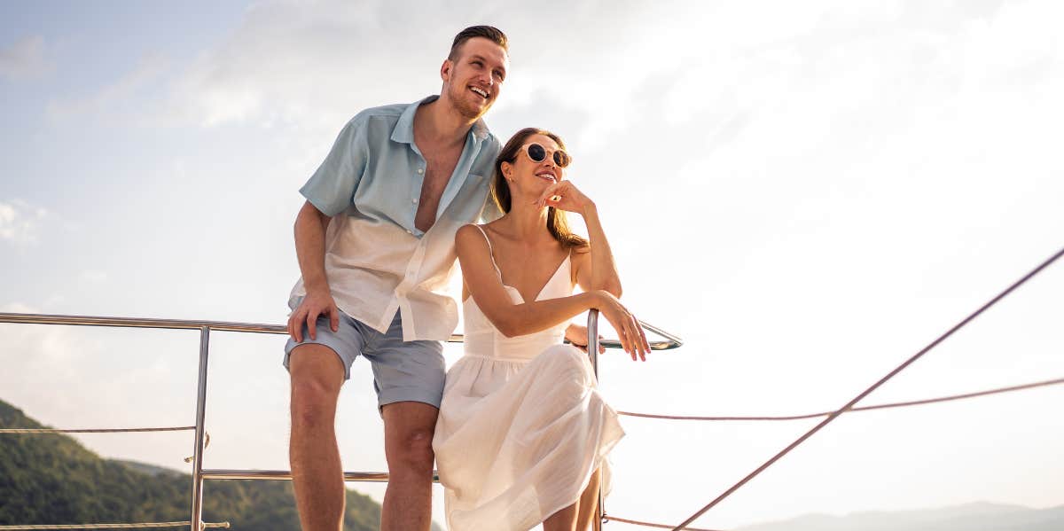 man and woman on railing 