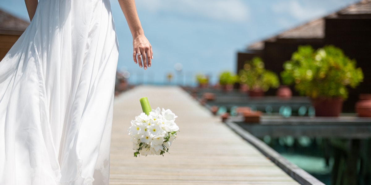 bride dropping bouquet