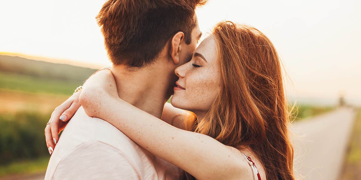 man and woman hugging and embracing 