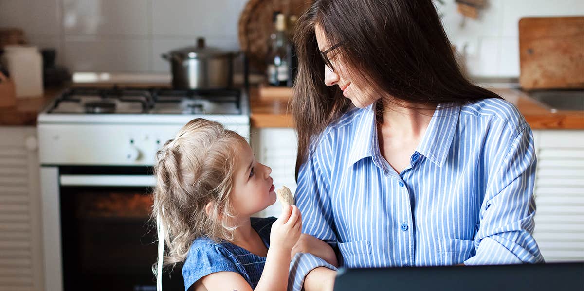 little girl asking mom a question