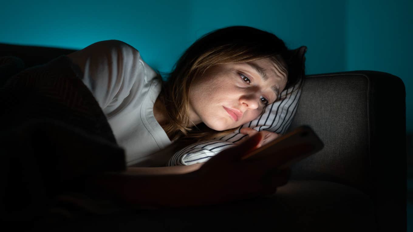 woman looking at phone