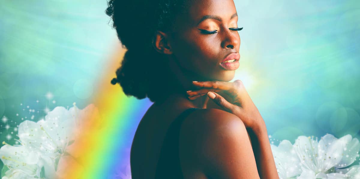 woman holding neck with rainbow