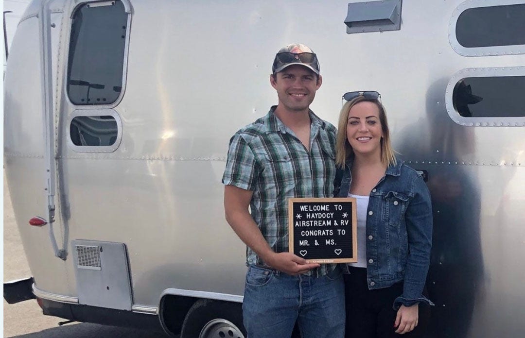 Heather and Austin Inspiring Story Inspiring photo of Heather and husband Austin captured in front of their Airstream