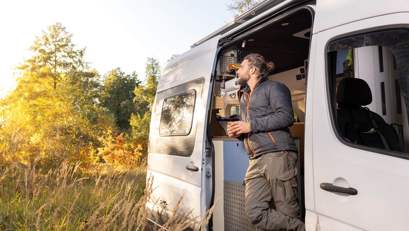 man living in a van with his fiancé and dog