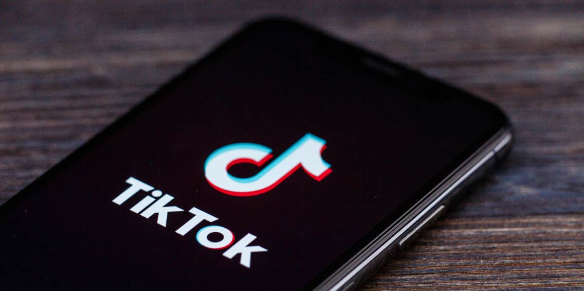 TikTok Trend Exposes 'December 17' School Shooting Threats Across The Country TikTok on phone