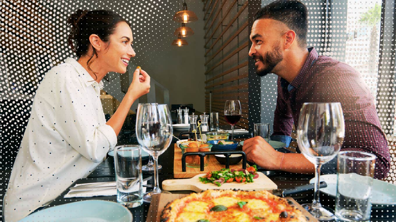 two people on a date eating pizza