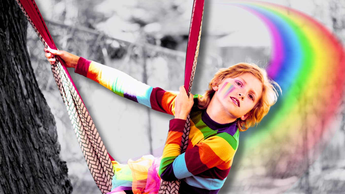 Young boy in rainbow sweater 
