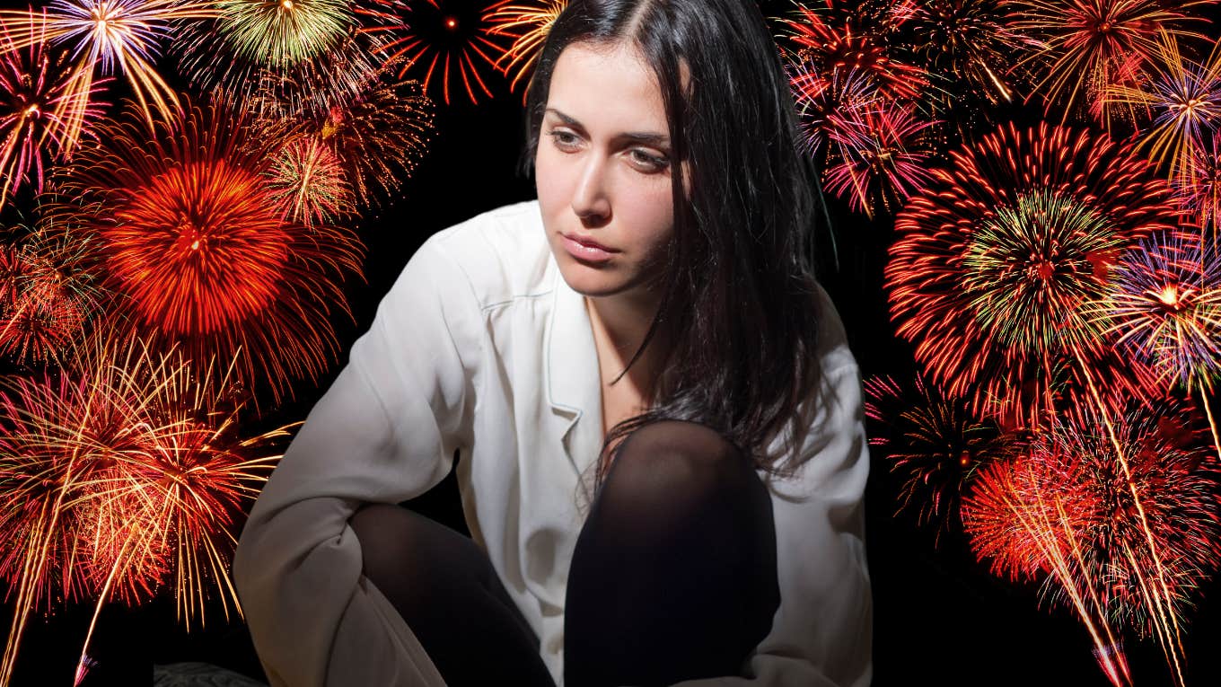 Woman feeling shame, surrounded by fireworks