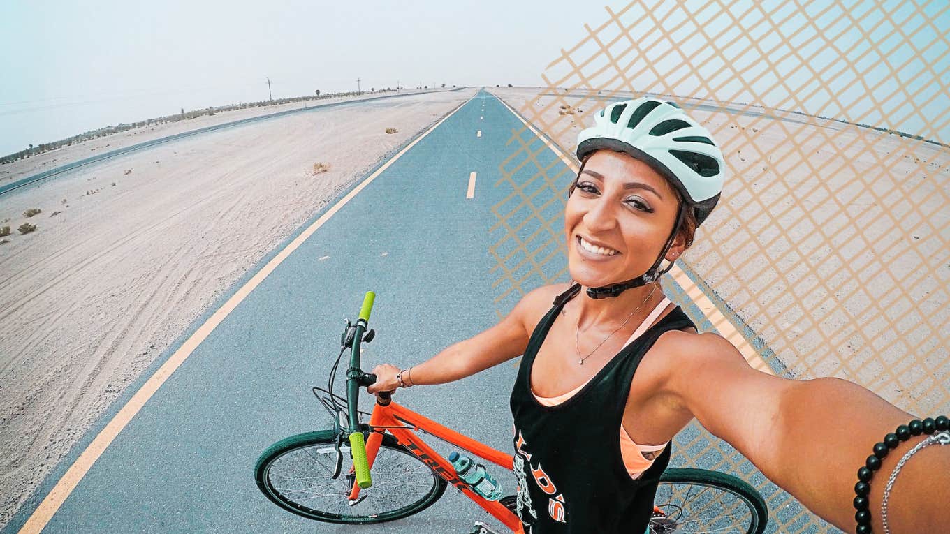 6 Little Tips For An Online Dating Photo He Can't Resist Woman taking a selfie on her bike ride