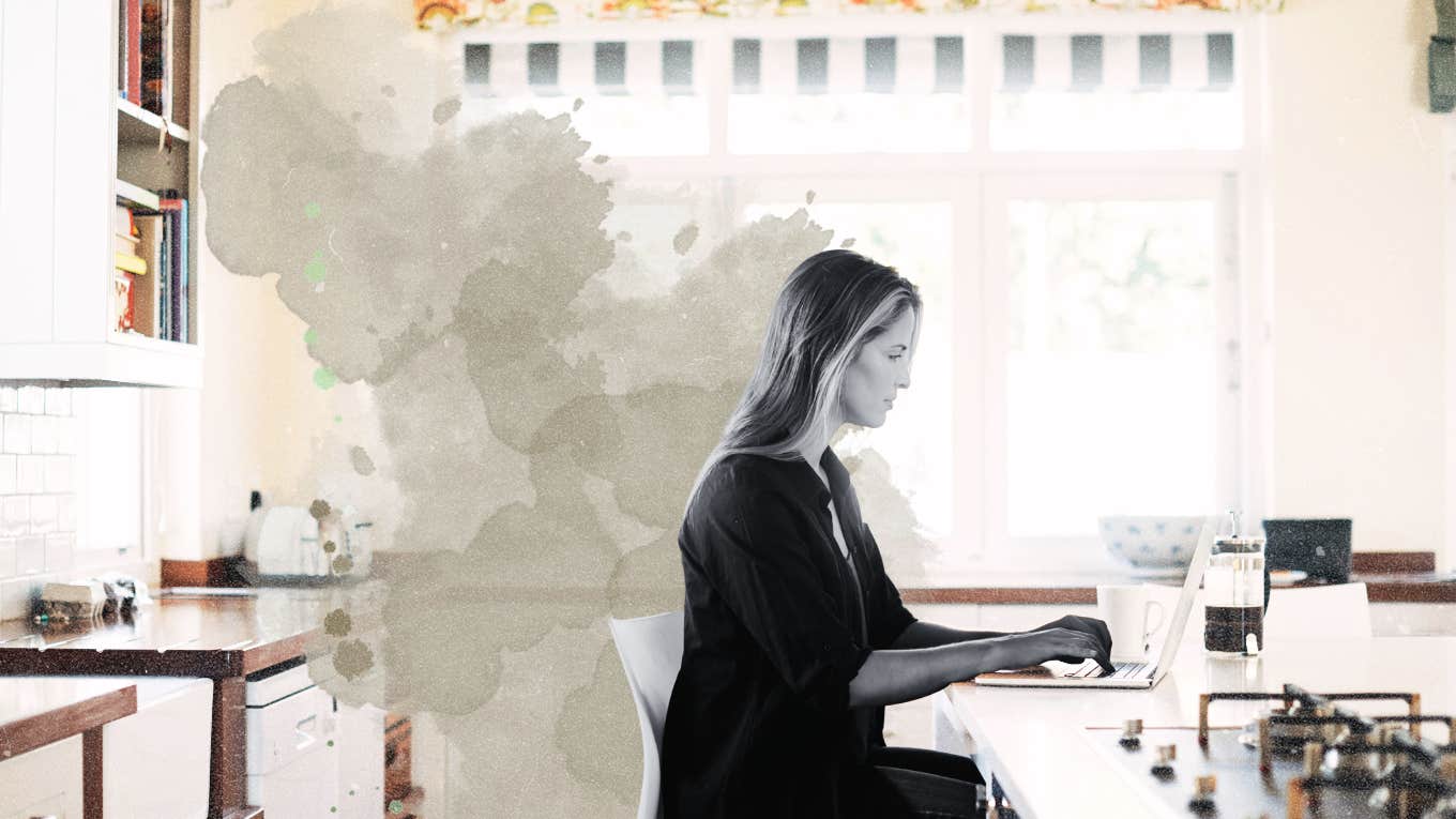 woman at kitchen island, scheduling her day