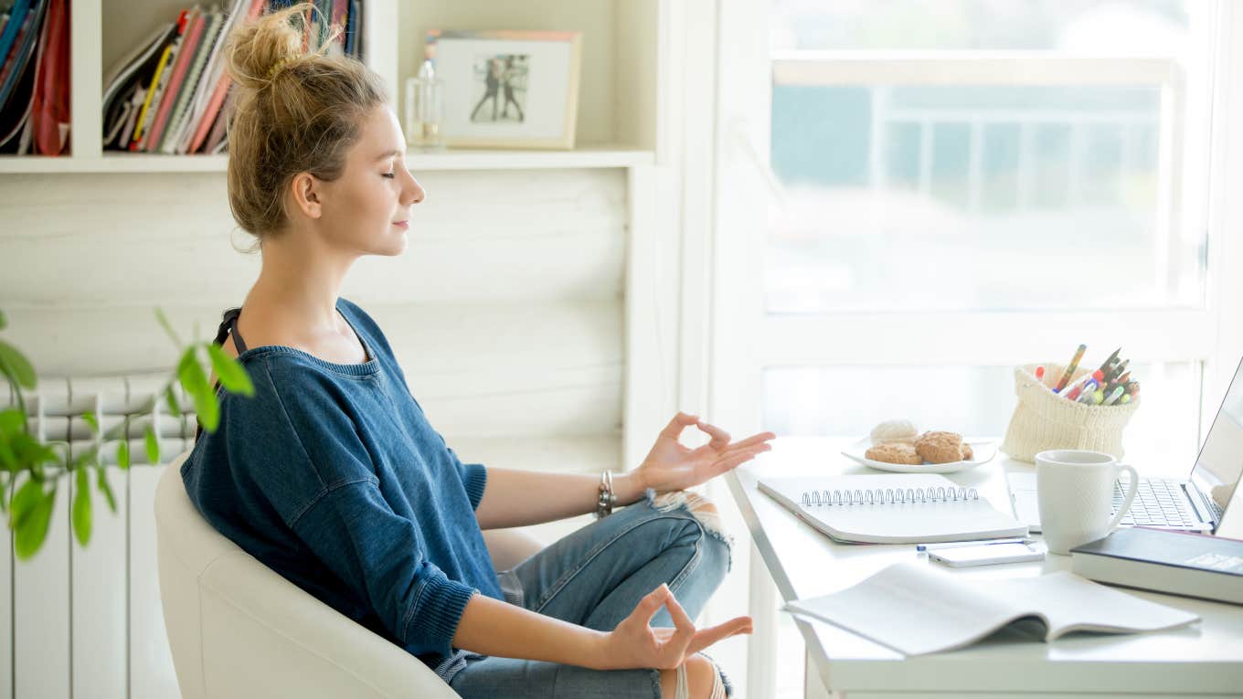 woman meditating at desk