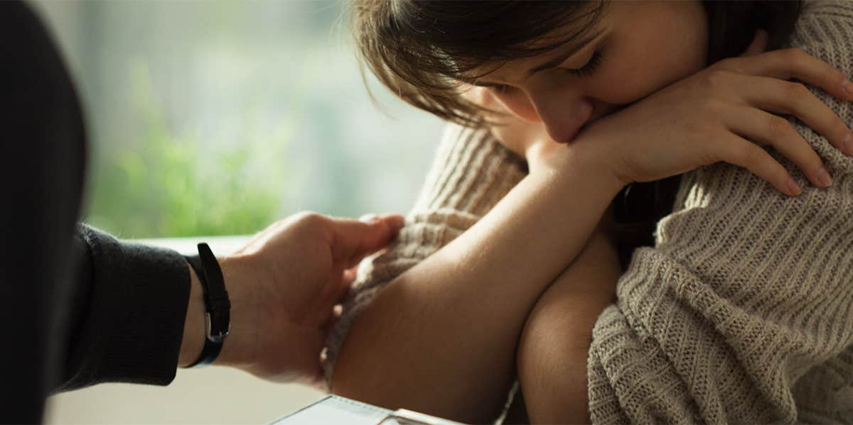 sad woman being comforted by friend