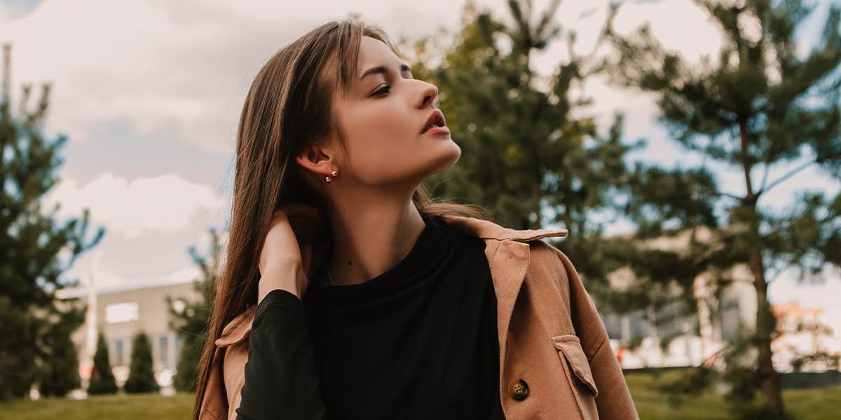 woman outside flipping her hair