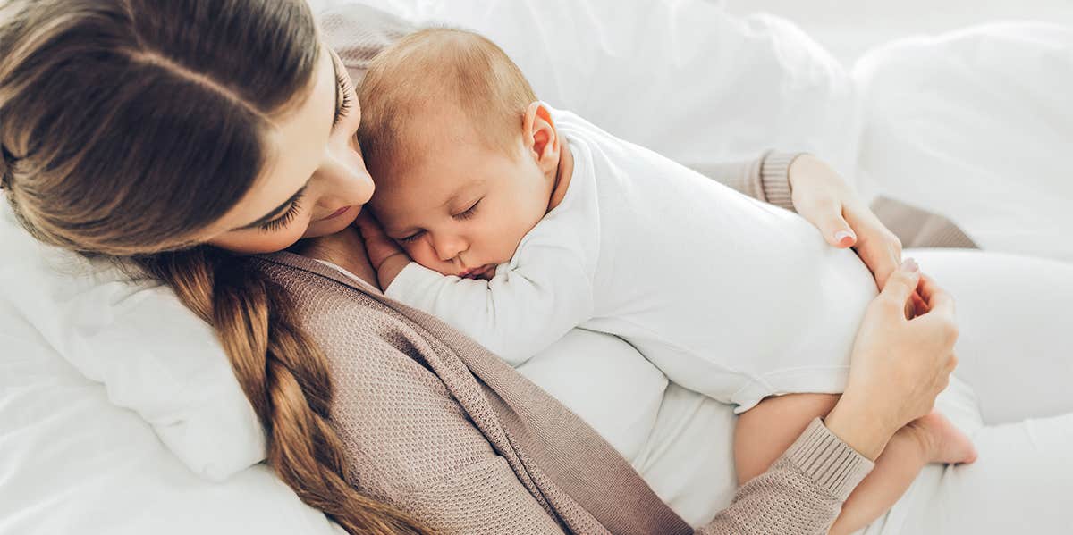 mother holding baby