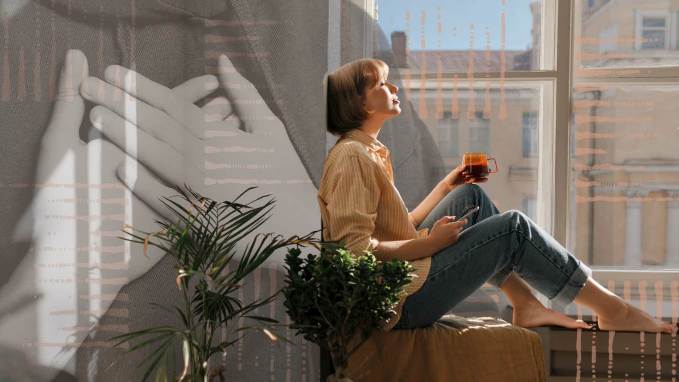 Woman decompressing in the window listening to music after caring for everyone around her