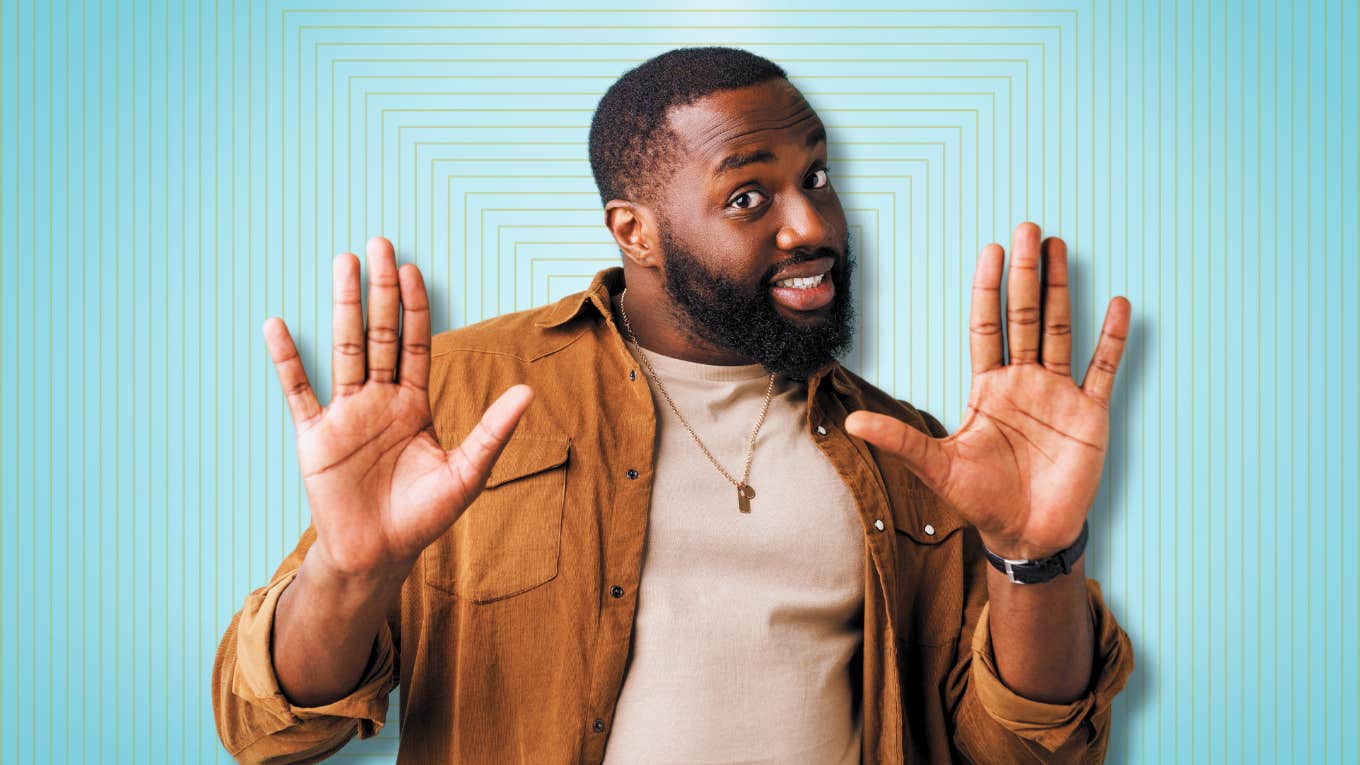 The #1 Mistake You Make That Instantly Scares Guys Away Man with both hands up, yikes!