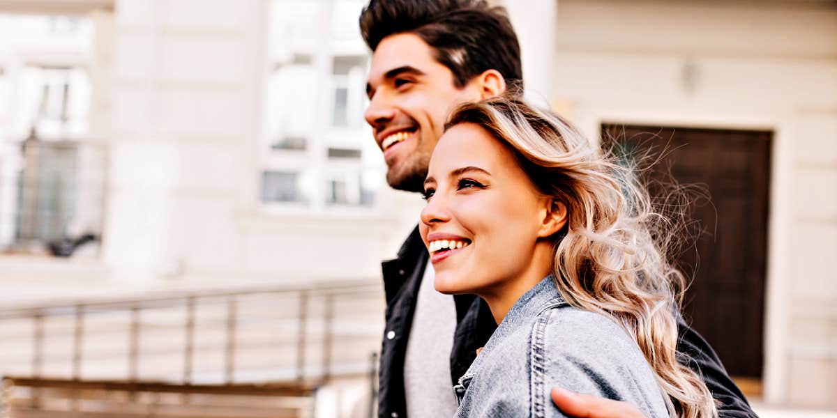 couple walking through a street