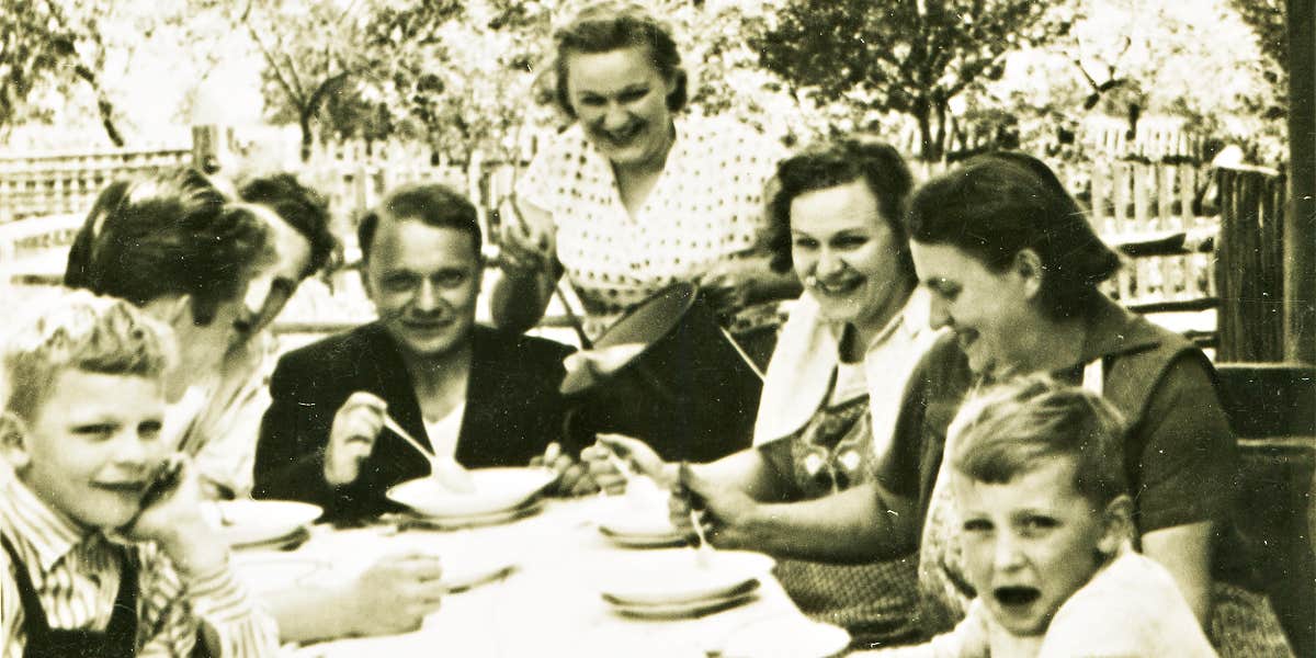 vintage photograph of a family at dinner