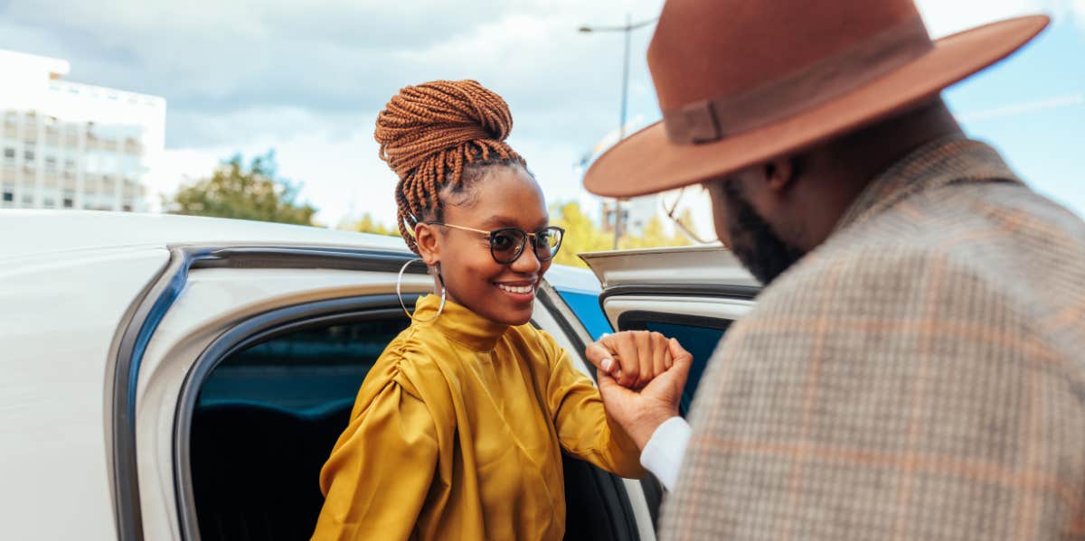 Traits Of Naturally Classy Women classy woman is helped out of the car by a man