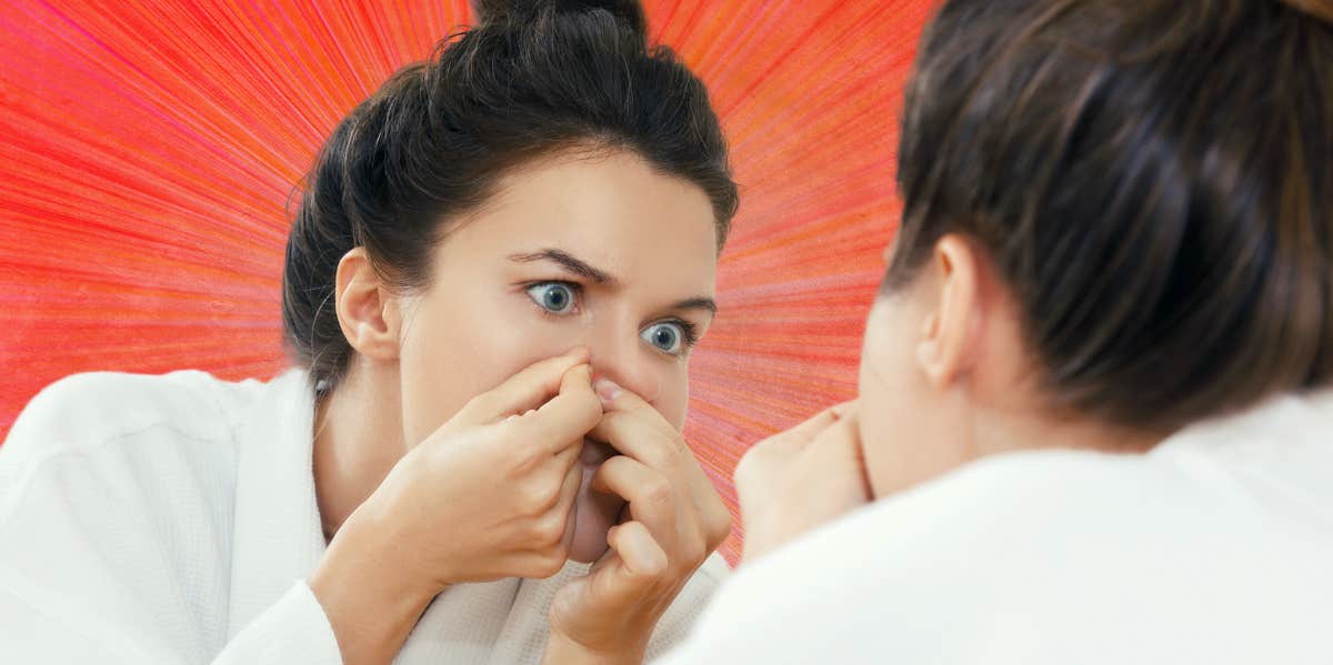 Why Popping Pimples In The Triangle Of Death Is So Dangerous woman popping a pimple