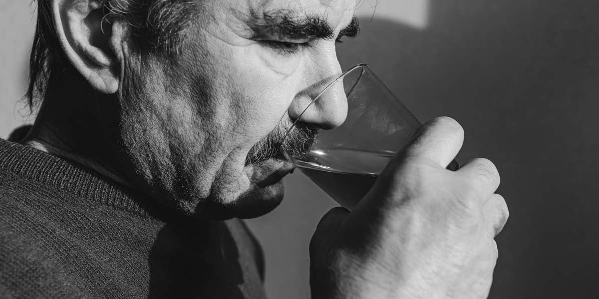 man drinking alcohol