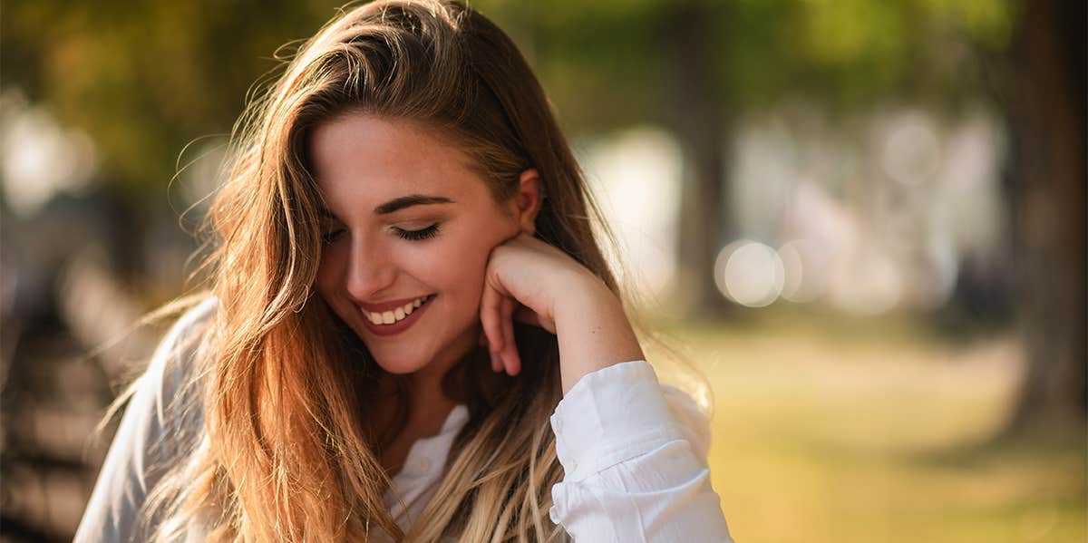 The Truth About Being An Extroverted Introvert shy woman smiling
