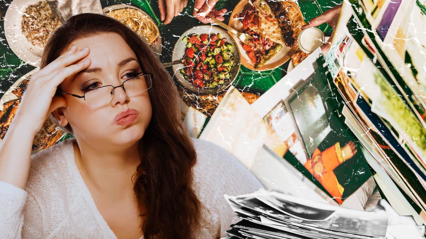 Exhausted Woman, pile of photographs and a dinner table behind her 