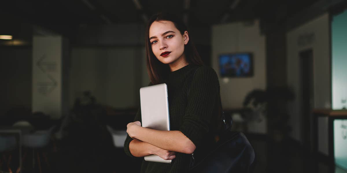 woman holding computer