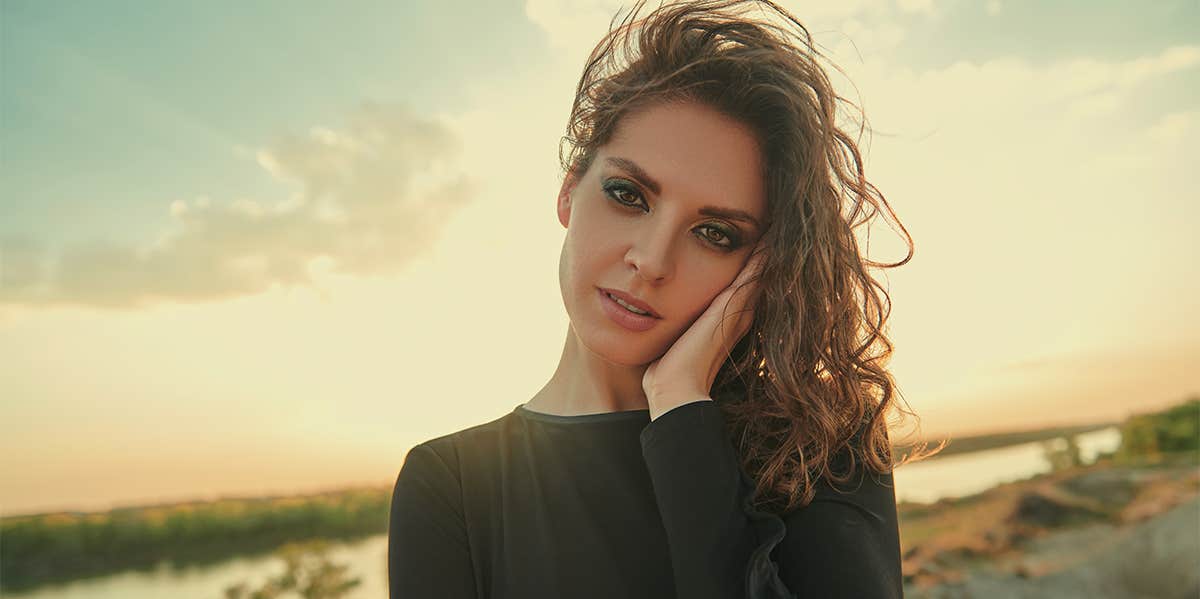 woman looking forward on beach