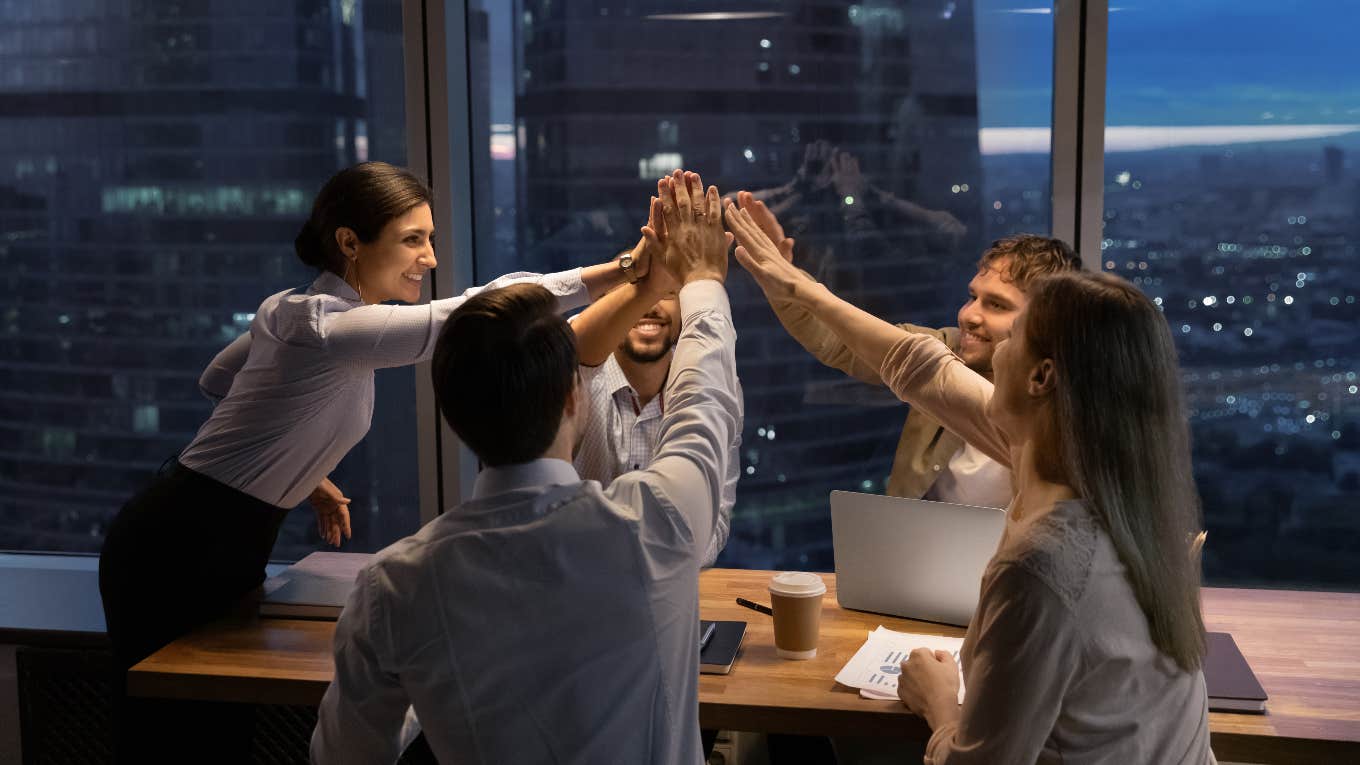 Office team high-fiving