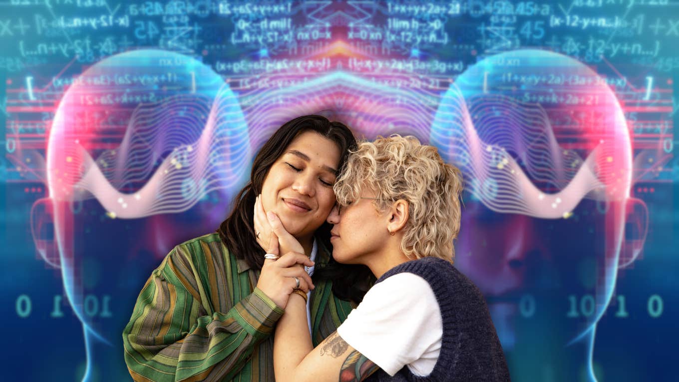 A non binary couple embraces in front of an image of brain waves