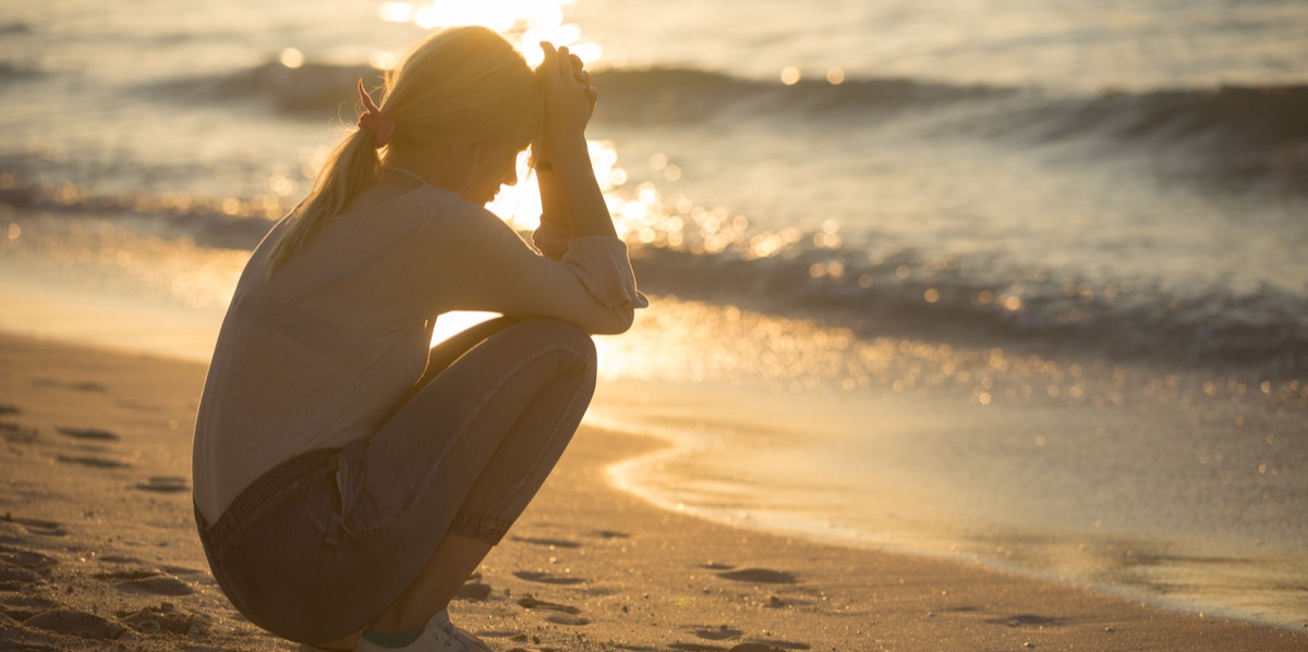 sad woman on beach