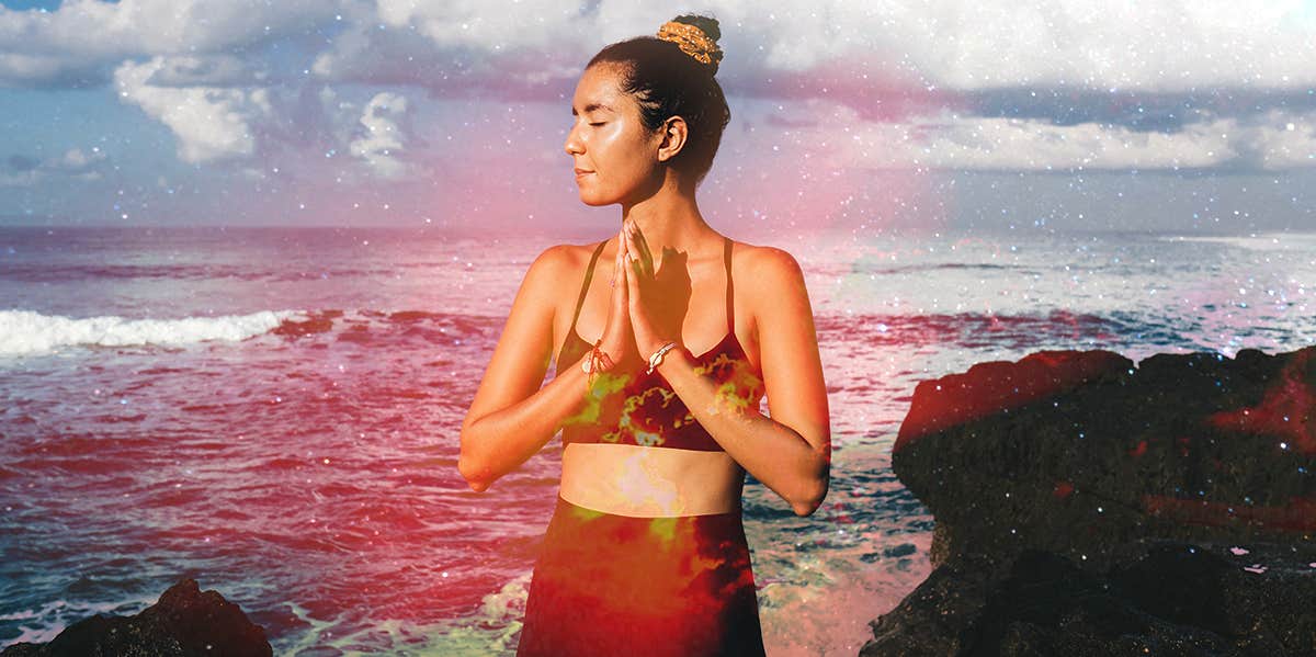 What The Sacral Chakra Represents & How To Unblock Yours woman with hands in prayer
