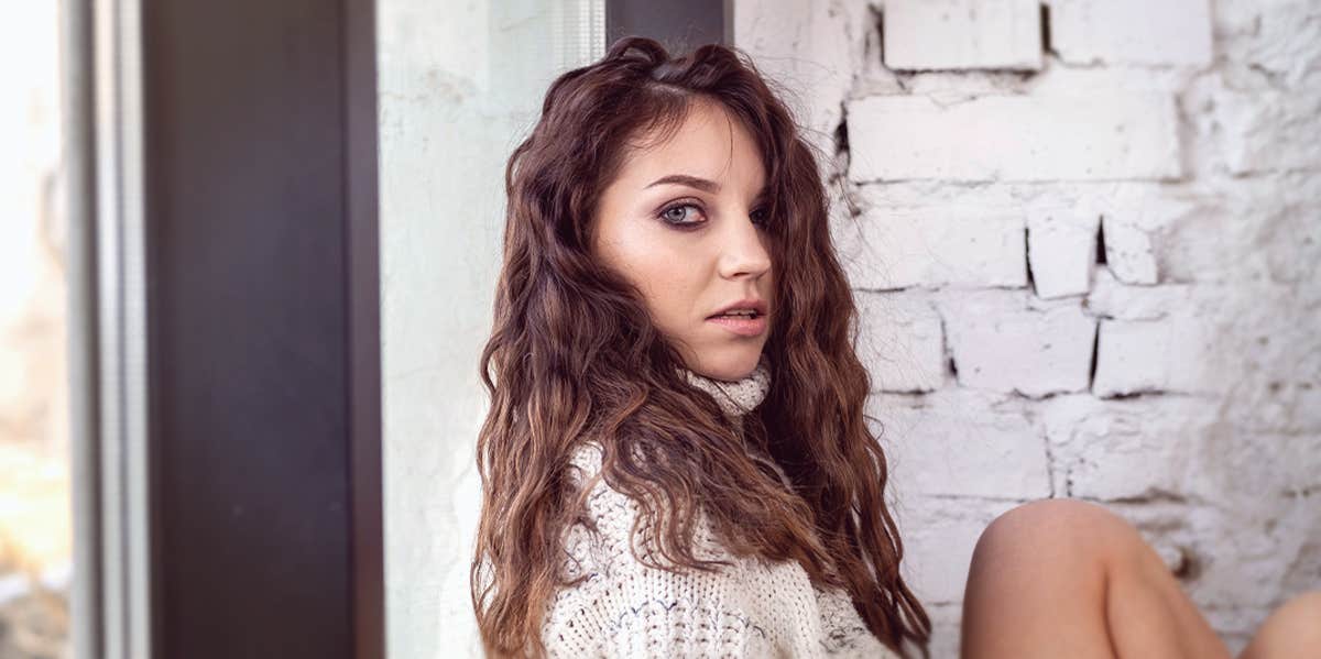 Harsh Signs You're Totally His Rebound woman looking to the camera