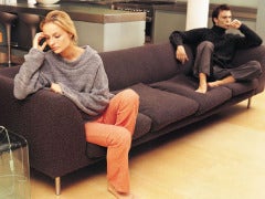 unhappy couple on couch