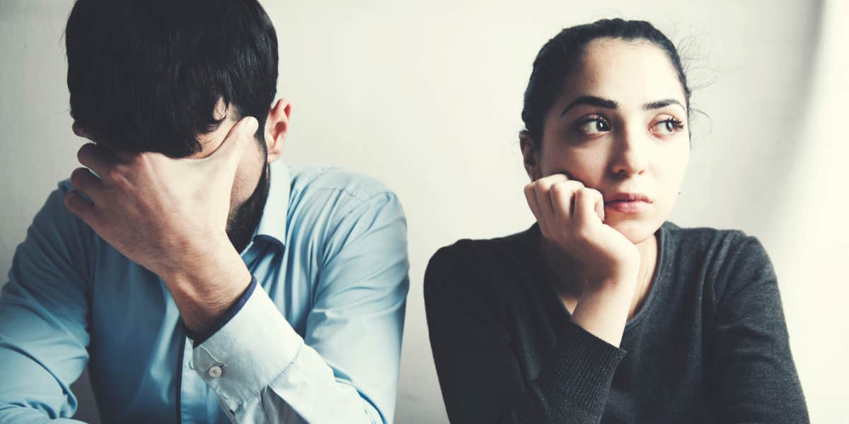 Why people fall into unhealthy love patterns man and woman in tense silence