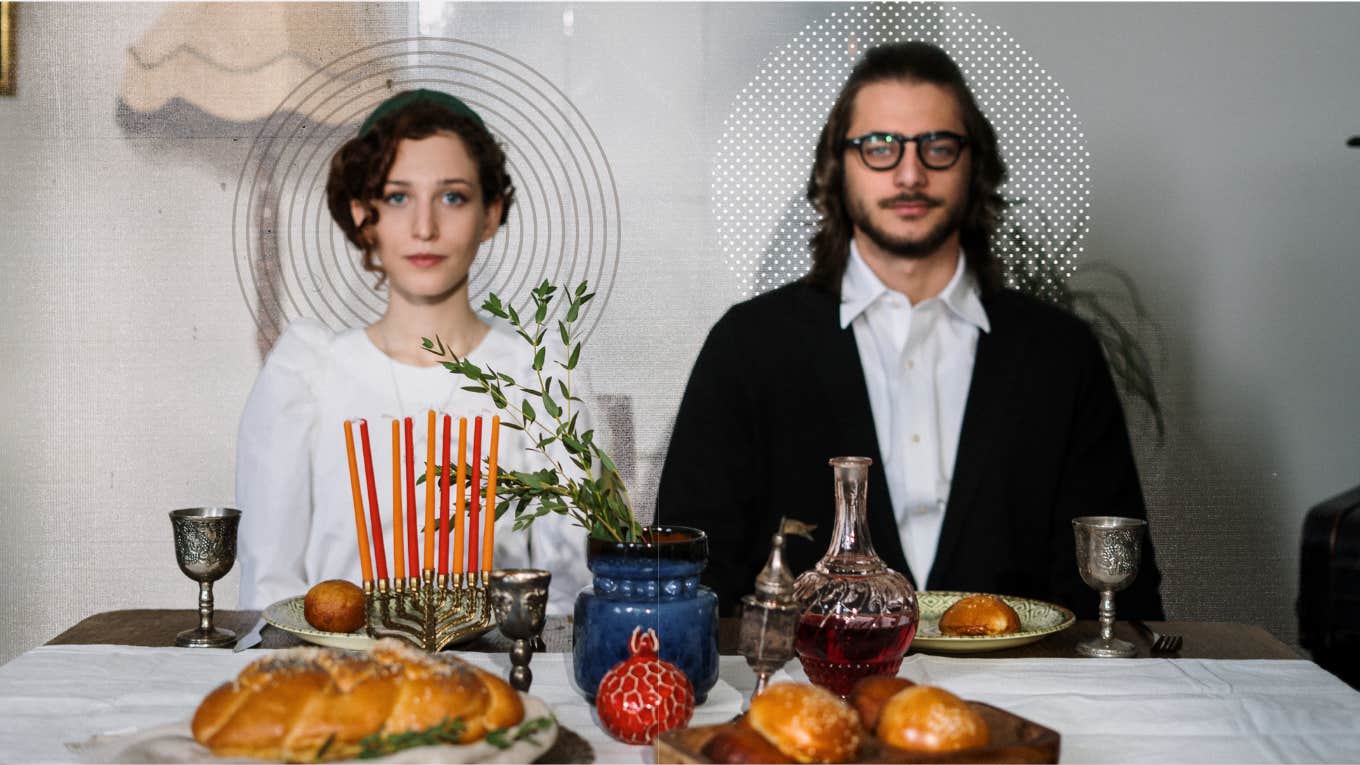 Couple sitting at a dinner table, not speaking staring straight ahead