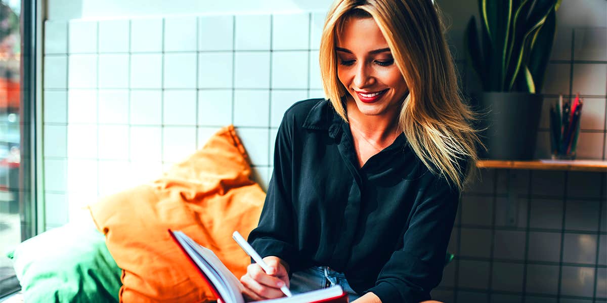 girl writing in notebook