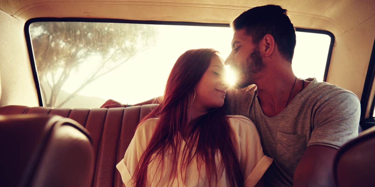 Universe's signs you're meant to be together couple in love, back seat of a vintage car