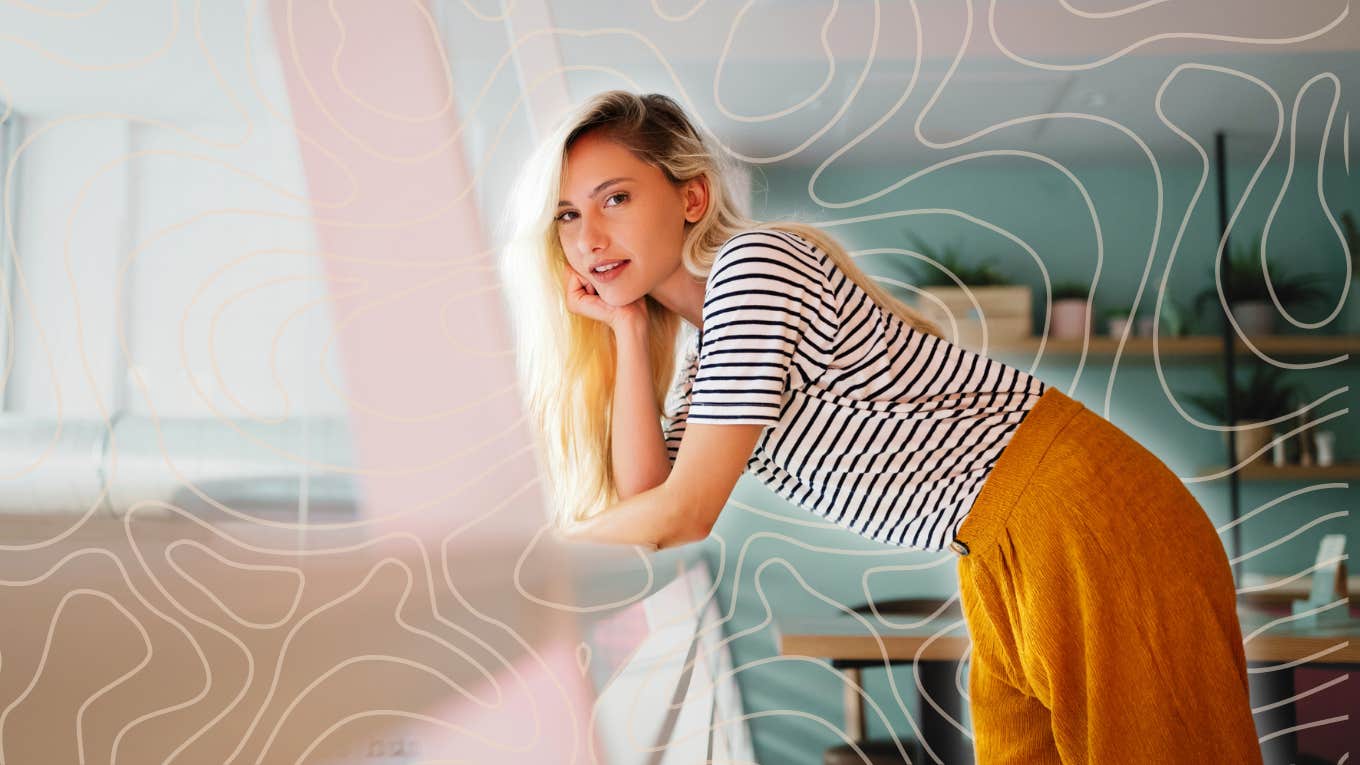 Happy woman leaning over railing