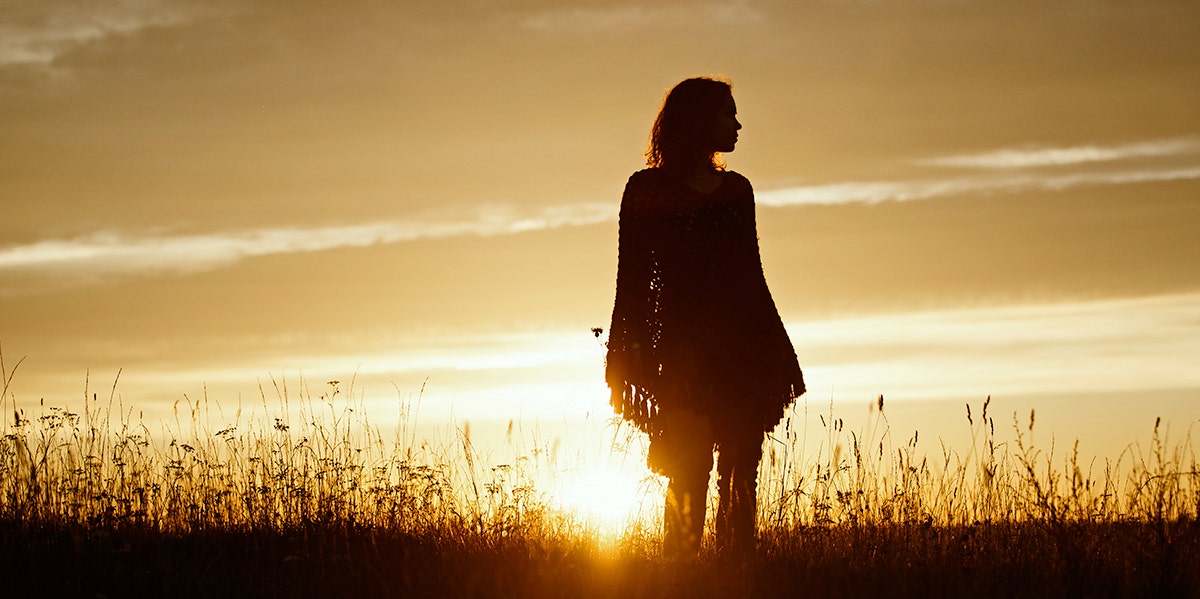 woman's silhouette at sunset