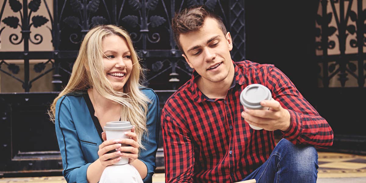 young couple, woman staring at man lovingly but he doesn't notice