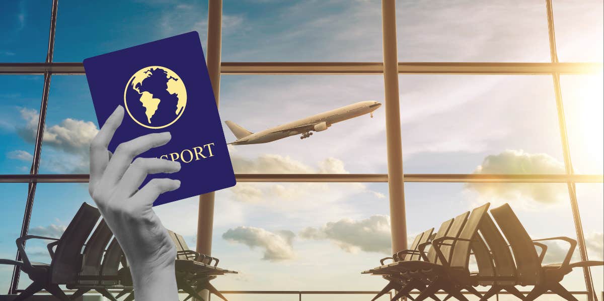 hand holding passport in airport