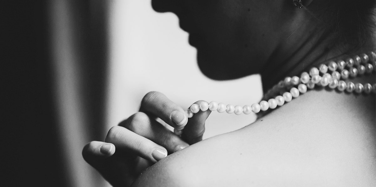 woman holding pearls