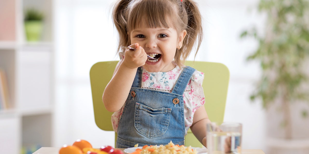 Why I'm Raising My Daughter As A Vegetarian Against Her Will young girl eating food