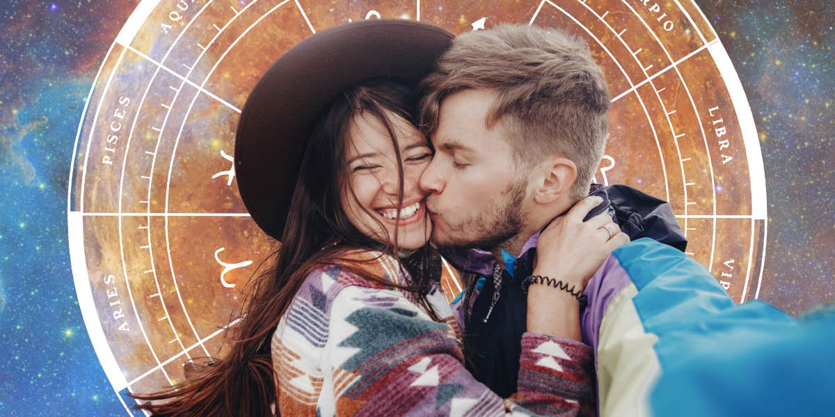 couple kissing in front of planet venus and zodiac wheel