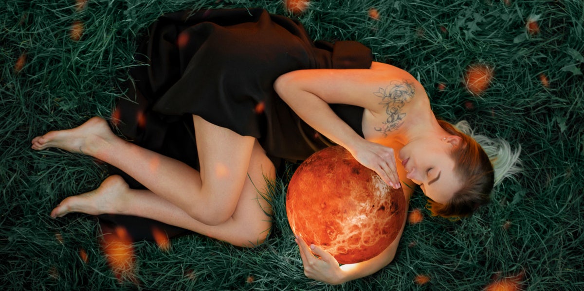 woman holding planet venus
